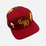 Load image into Gallery viewer, Chrome Hearts snapback cap in red and yellow with leather cross patch and CH branding, view 2