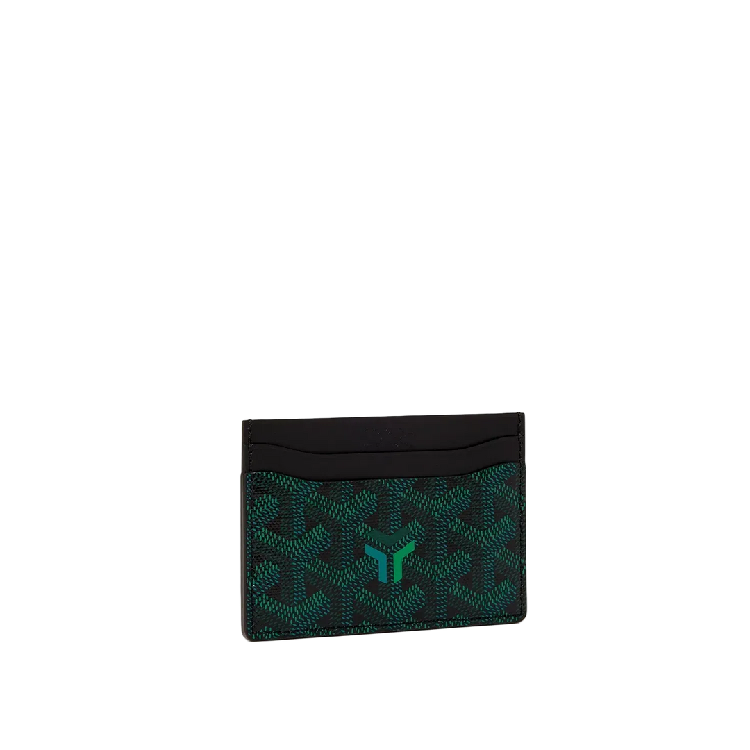 A Goyard card holder wallet featuring the brand's signature dark green and black chevron pattern with a green 'G' logo on the front, set against a solid off-white background.