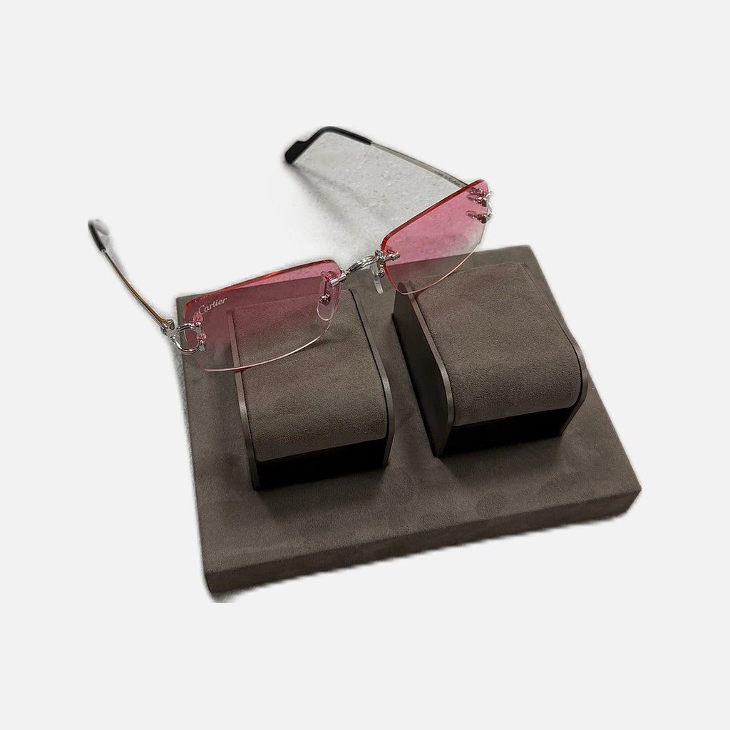 Cartier CC sunglasses with a silver frame and pink tint lenses