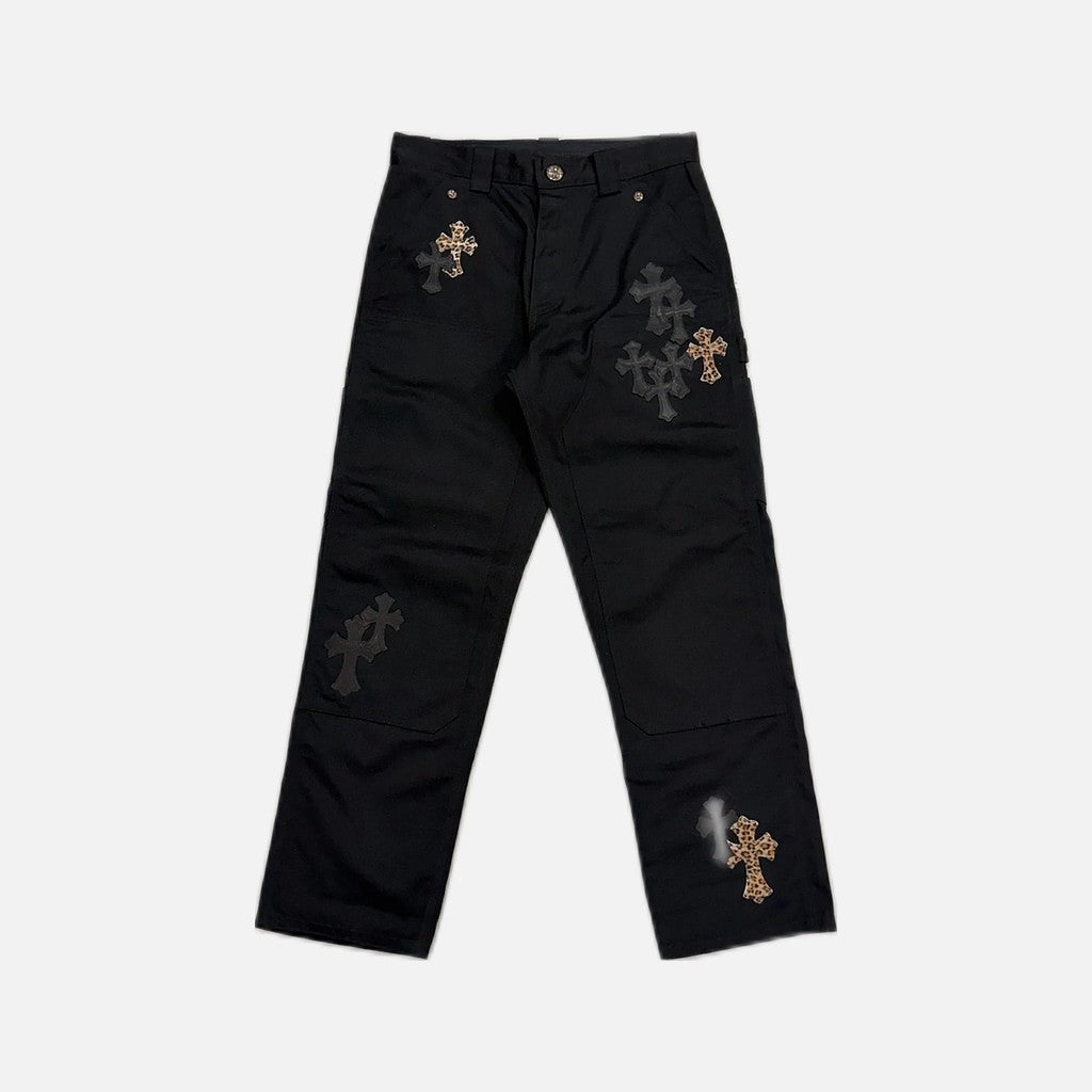 Chrome Hearts double knee carpenter jeans in black and brown with leather and cheetah cross patches