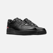Nike x Supreme Air Force 1 Low Box Logo sneakers in black leather with red box logo on the heel