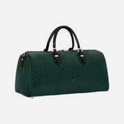 A dark green Goyardine monogram duffel bag with black leather handles and silver-tone hardware, photographed on a clean off-white background.
