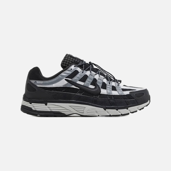 Nike P-6000 Premium sneaker in dark anthracite mesh with smoke grey leather overlays and metallic accents