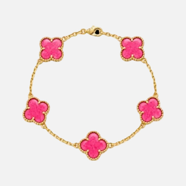 A gold chain bracelet featuring five bright pink clover-shaped charms, each outlined with a textured gold border, displayed on a clean white background.